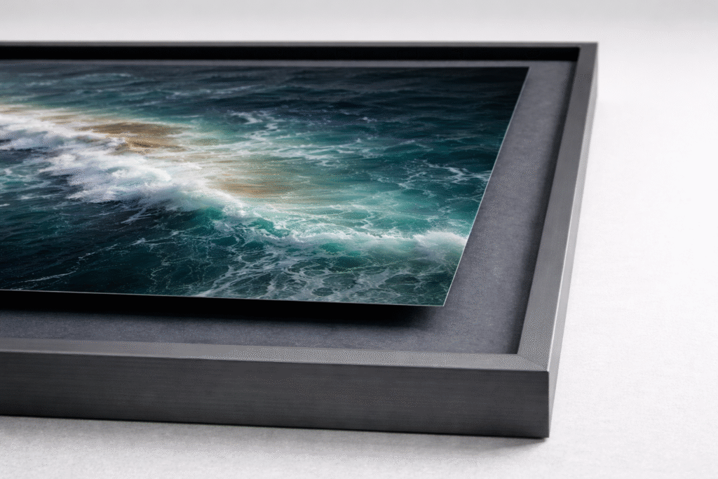 Float-mounted fine art print inside a matte anodised aluminium frame with dark mount board.